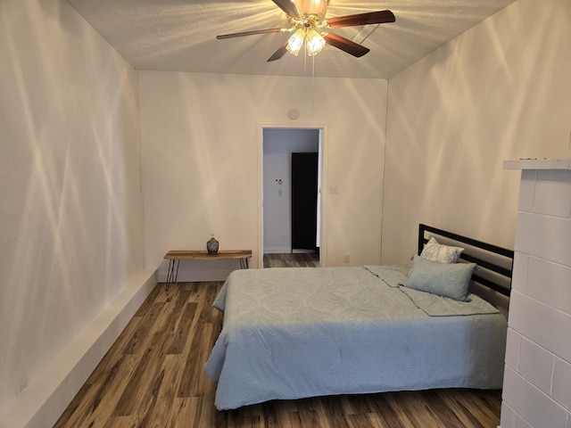 bedroom featuring ceiling fan and dark hardwood / wood-style floors