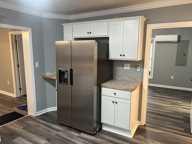 kitchen featuring white cabinets, stainless steel fridge, crown molding, and a wall unit AC