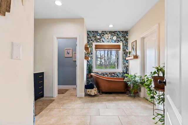 interior space featuring light tile patterned floors, recessed lighting, and baseboards