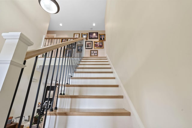 staircase featuring recessed lighting