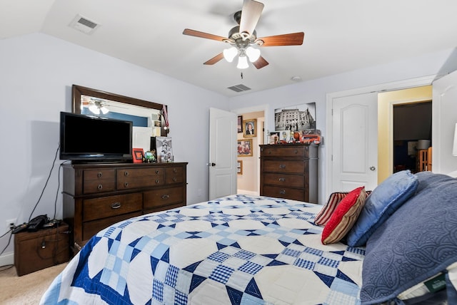 bedroom featuring visible vents, carpet flooring, a ceiling fan, and vaulted ceiling