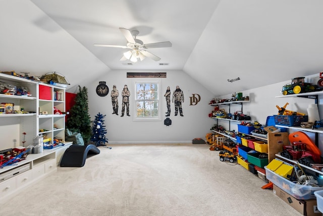 recreation room with visible vents, carpet, ceiling fan, and vaulted ceiling