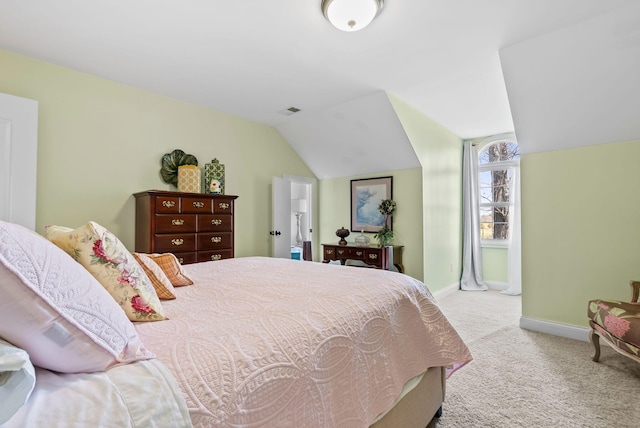 bedroom featuring visible vents, baseboards, carpet, and lofted ceiling