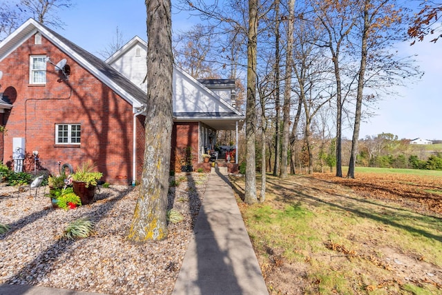 view of front of property featuring a porch and brick siding