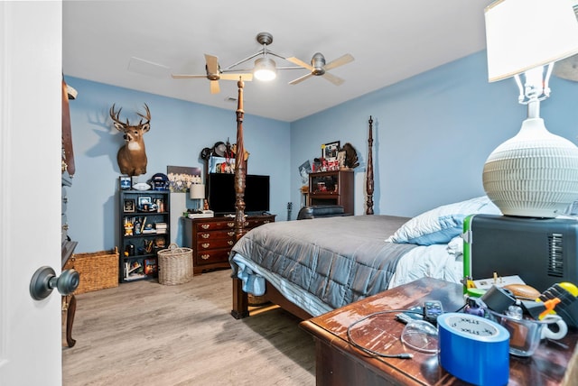 bedroom featuring wood finished floors and ceiling fan