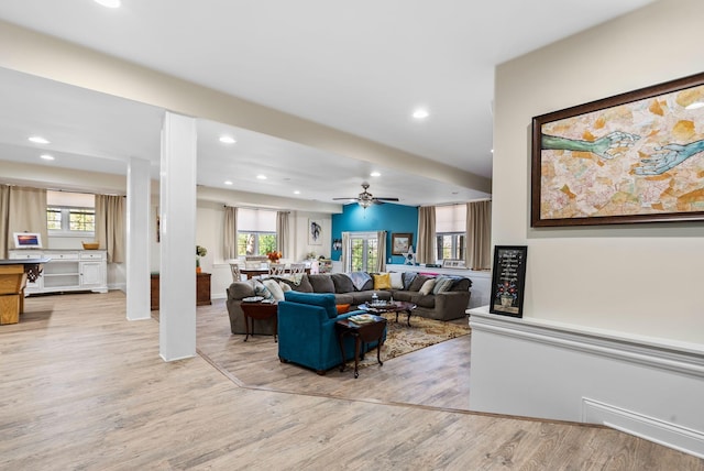 living room with light wood finished floors, recessed lighting, and a ceiling fan