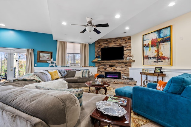 living area with recessed lighting, french doors, wood finished floors, and a fireplace