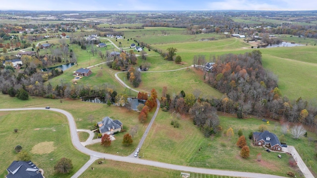 aerial view featuring a rural view and a water view