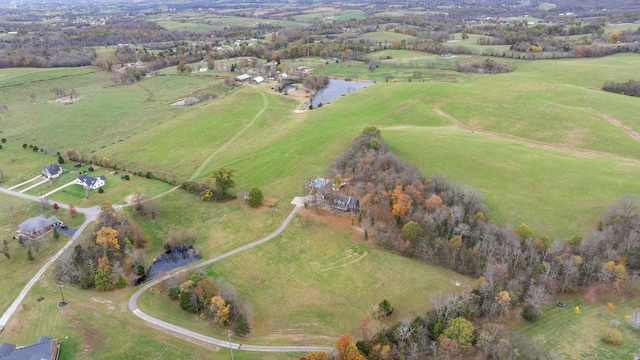 drone / aerial view featuring a water view and a rural view