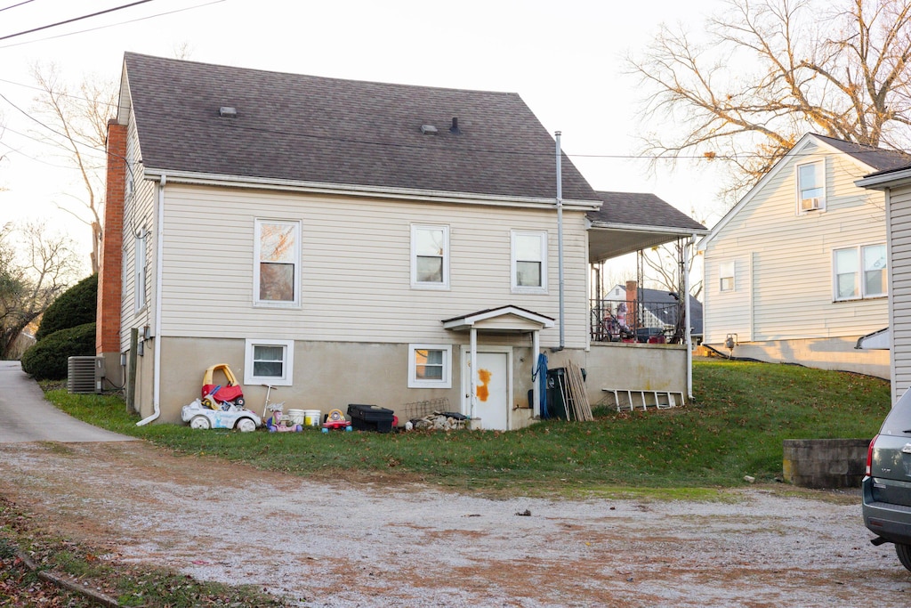 back of house featuring central AC