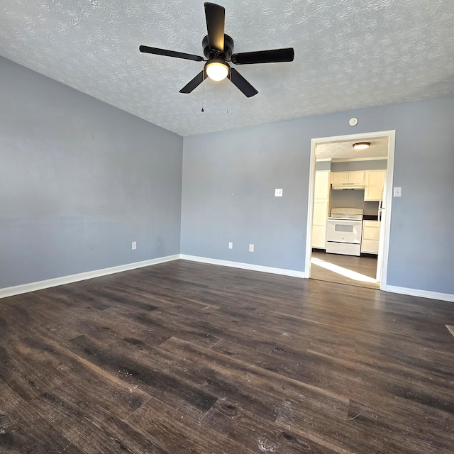 unfurnished room featuring dark hardwood / wood-style flooring, ceiling fan, and a textured ceiling