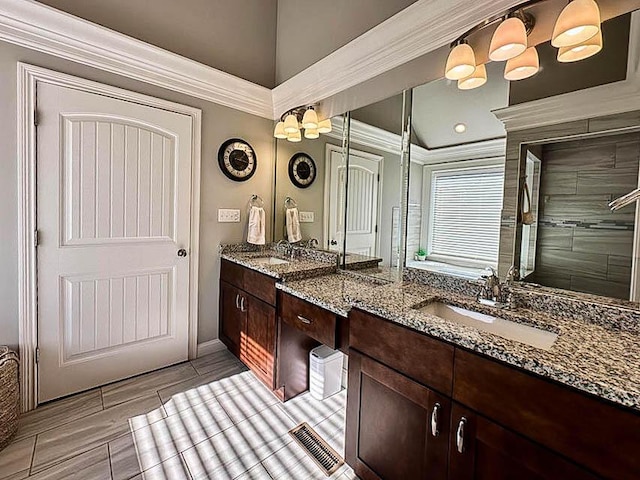 bathroom featuring crown molding, vanity, lofted ceiling, and hardwood / wood-style flooring