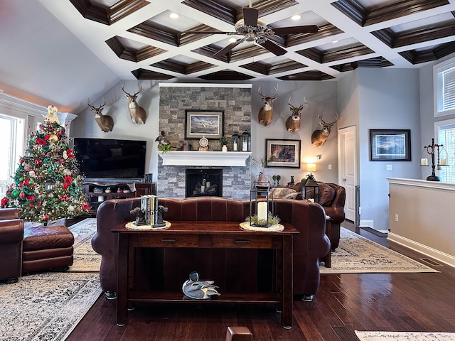 living room with a fireplace, beam ceiling, and dark wood-type flooring