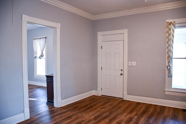 entrance foyer with dark hardwood / wood-style floors and crown molding