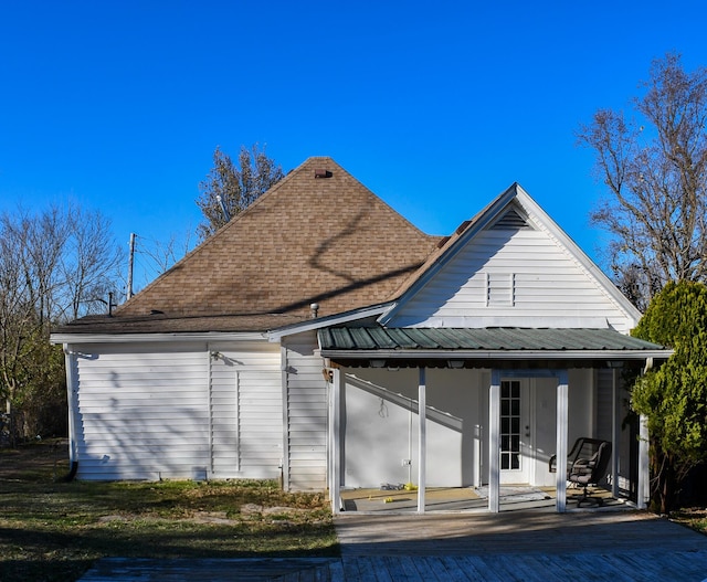 back of house featuring covered porch