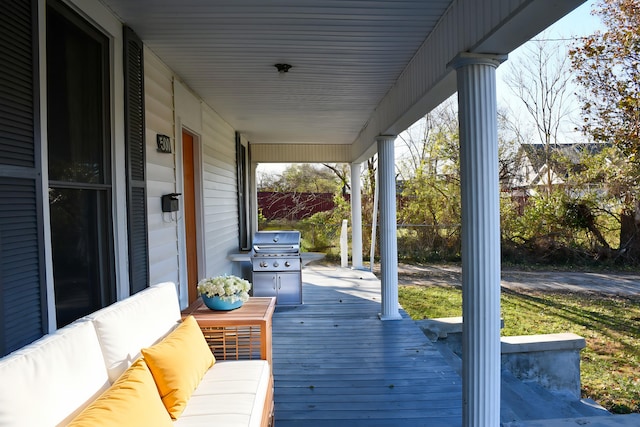 wooden terrace with area for grilling