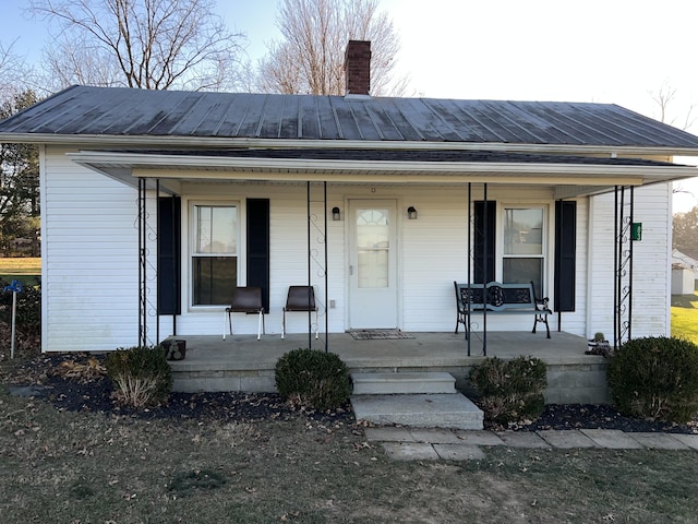 ranch-style home featuring covered porch