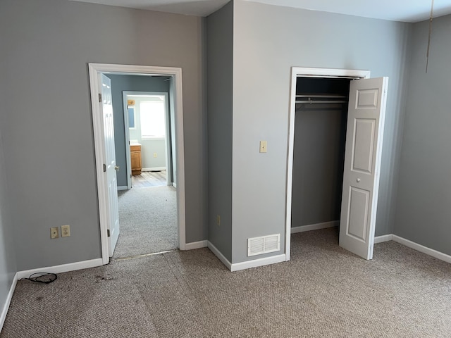 unfurnished bedroom with light carpet