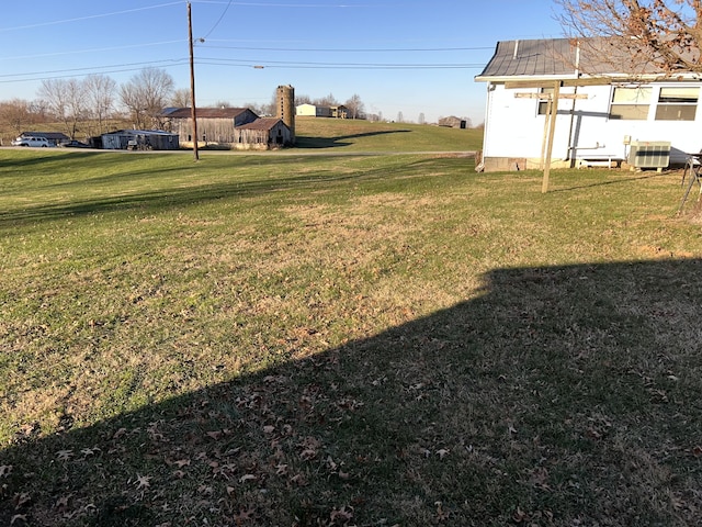 view of yard featuring central AC