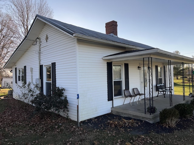 view of home's exterior with covered porch