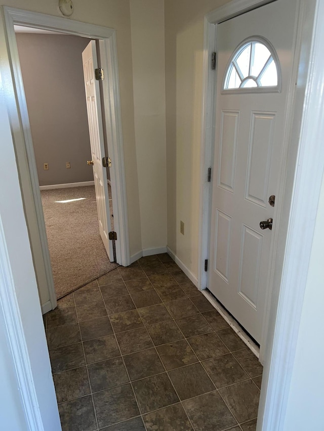 view of carpeted foyer