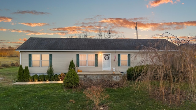 view of front of house with a lawn