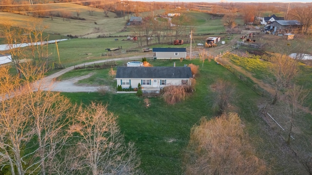 birds eye view of property featuring a rural view