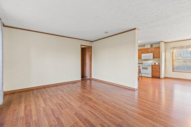 unfurnished living room with ornamental molding, light hardwood / wood-style floors, and a textured ceiling