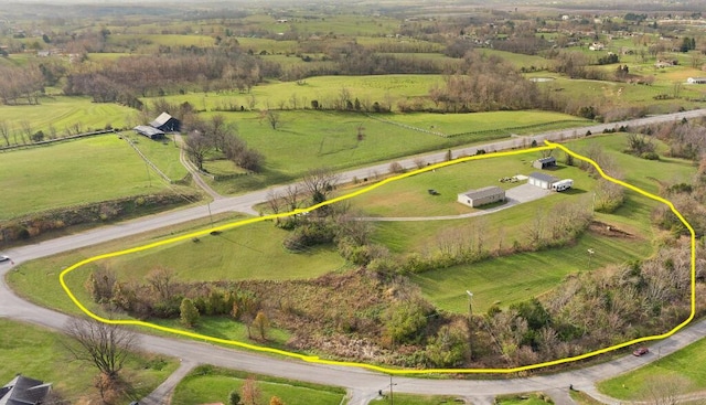 birds eye view of property featuring a rural view