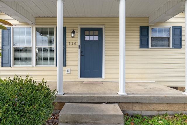 doorway to property with a porch