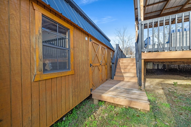 view of side of home with an outbuilding