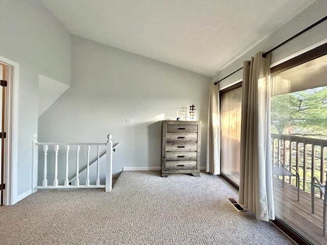 bonus room with carpet, a healthy amount of sunlight, and vaulted ceiling