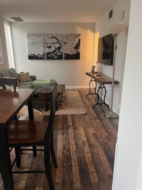 dining area featuring dark hardwood / wood-style floors