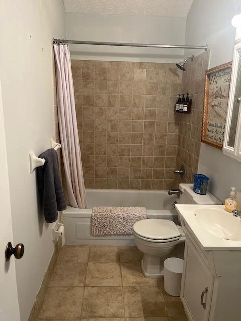 full bathroom featuring vanity, toilet, and shower / bathtub combination with curtain