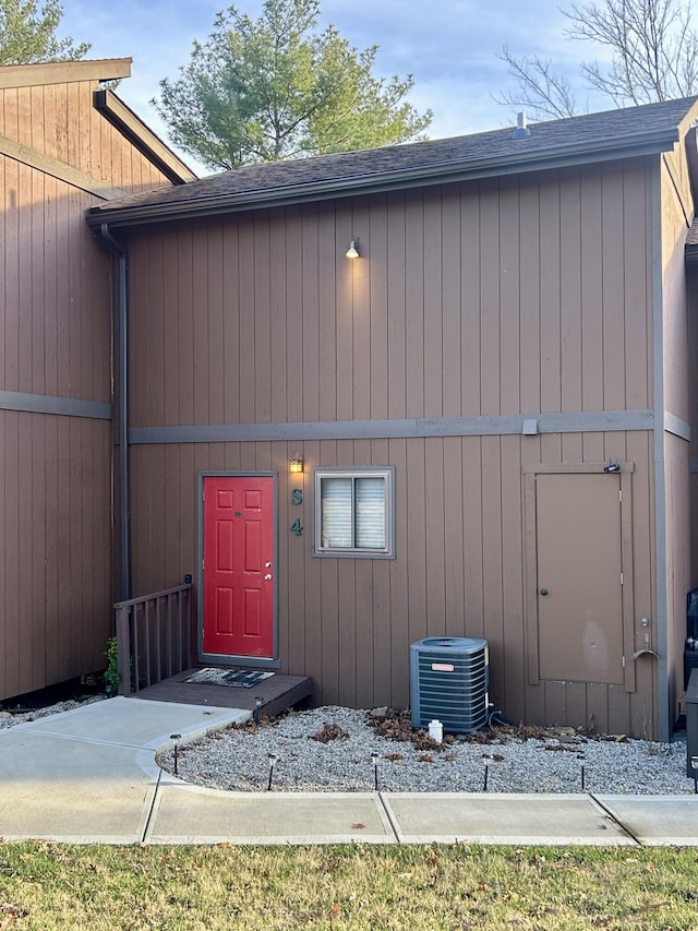 entrance to property featuring central air condition unit