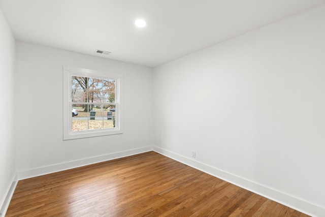 empty room featuring hardwood / wood-style flooring