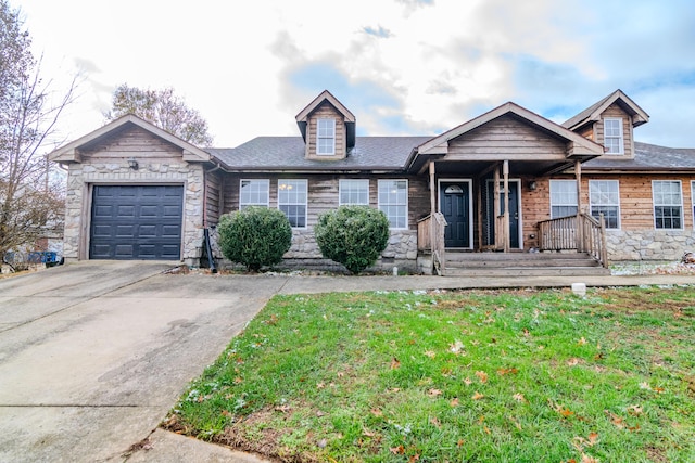 view of front of home featuring a garage and a front lawn