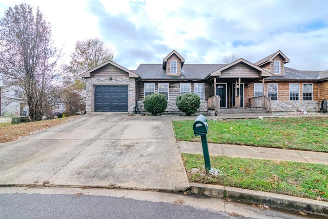 view of front of home with a garage and a front yard