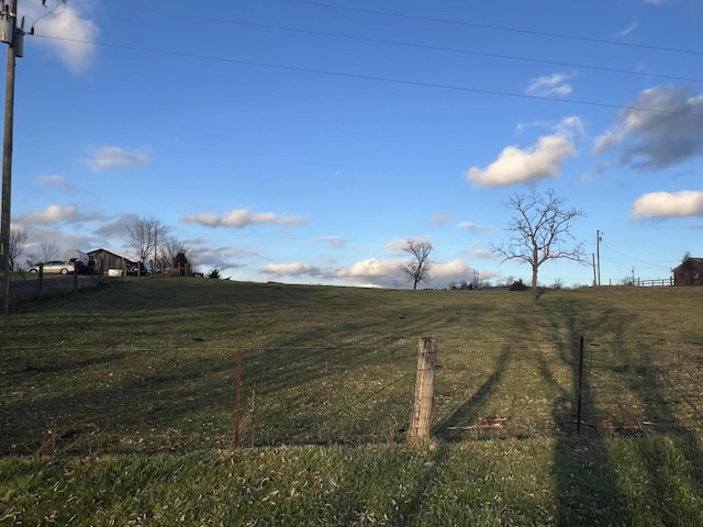 view of yard with a rural view