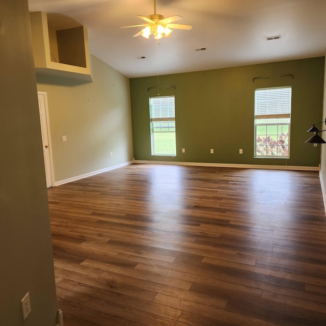 unfurnished room featuring dark hardwood / wood-style flooring and ceiling fan