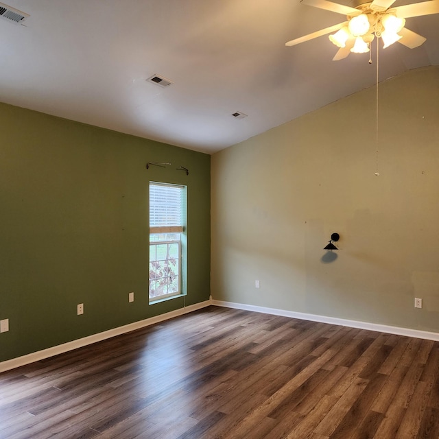 unfurnished room featuring ceiling fan, lofted ceiling, and dark wood-type flooring