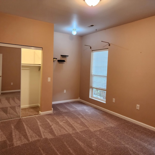 unfurnished room with carpet