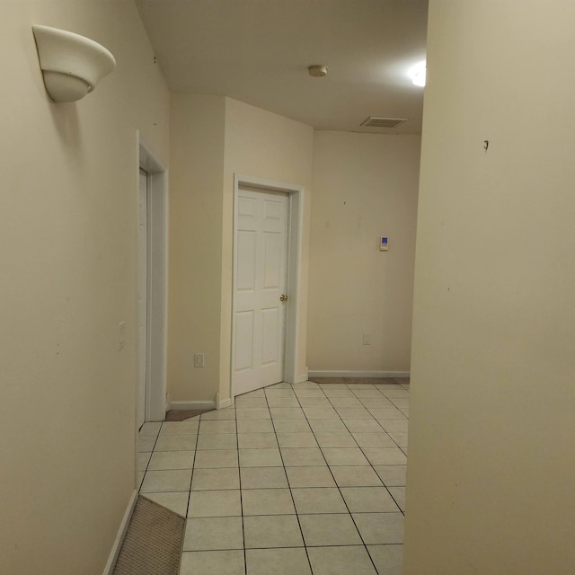 hallway with light tile patterned floors