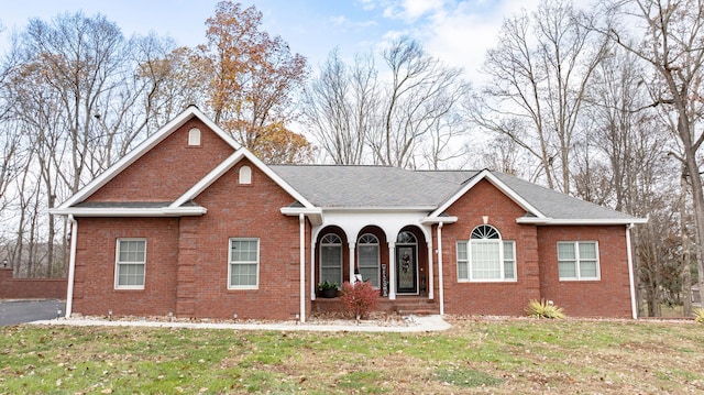 view of front of house featuring a front yard and a porch