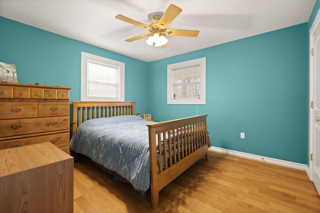 bedroom featuring ceiling fan and light wood-type flooring