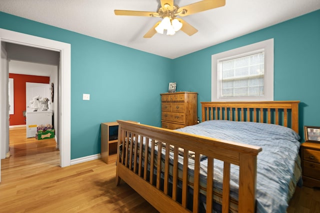 bedroom featuring light hardwood / wood-style flooring and ceiling fan