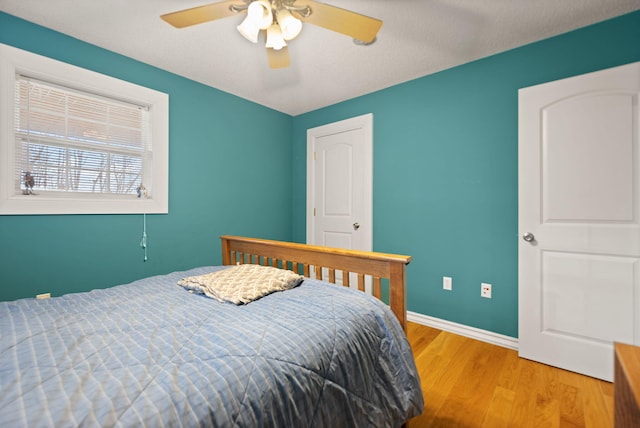 bedroom featuring ceiling fan and light wood-type flooring