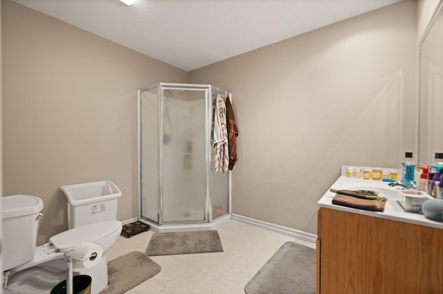 bathroom with vanity, an enclosed shower, and toilet