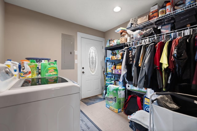 washroom with electric panel and separate washer and dryer