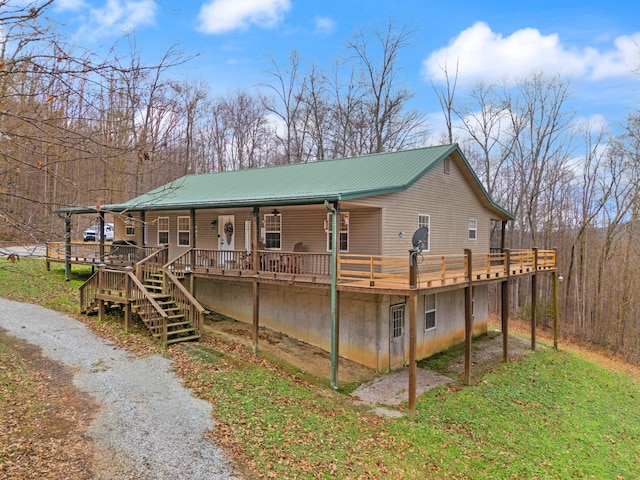 view of front of property featuring covered porch and a wooden deck